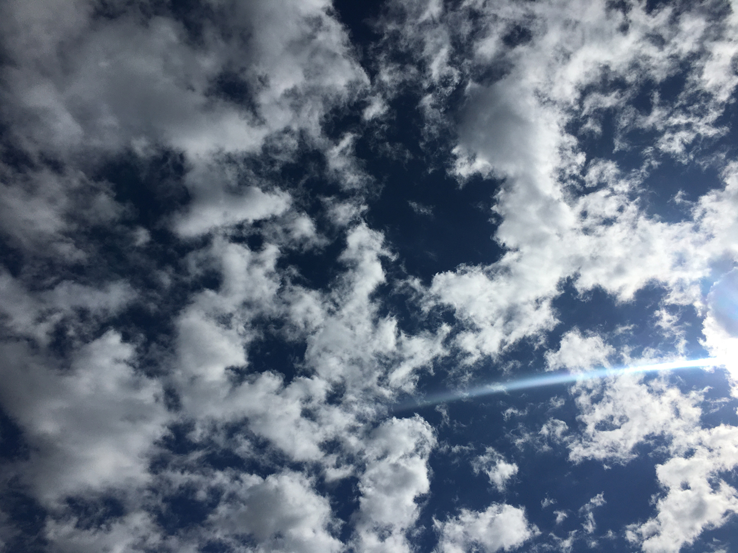 Katie Jeanne Wood - clouds in blue sky