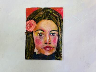 Oil pastel & oil paint portrait painting of a girl wearing a pink rose in her hair by Katie Jeanne Wood
