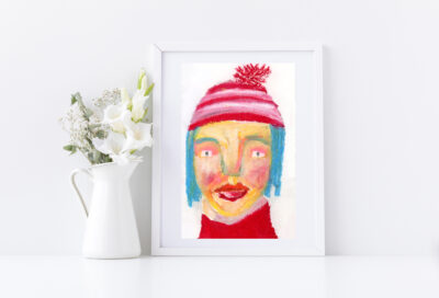 Oil pastel drawing of a person wearing a red winter hat with pompom