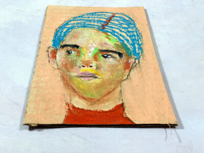 Oil pastel drawing of a person with blue hair