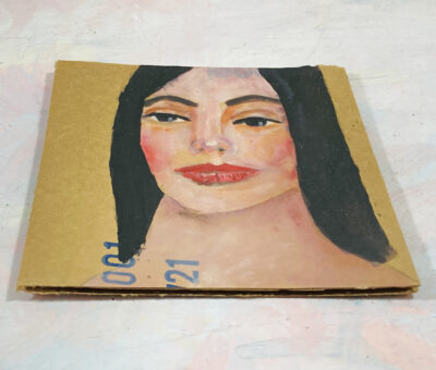 Acrylic portrait painting of a woman on cardboard