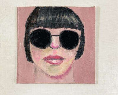 Oil pastel drawing of a woman wearing black sunglasses by Katie Jeanne Wood