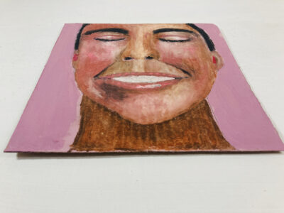 Oil pastel drawing of a happy, smiling person by Katie Jeanne Wood