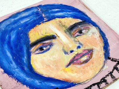 Oil pastel portrait painting of a tranquil woman with blue hair by Katie Jeanne Wood