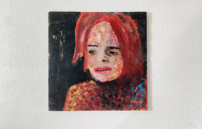 Acrylic portrait painting of a red haired woman on cardboard by Katie Jeanne Wood