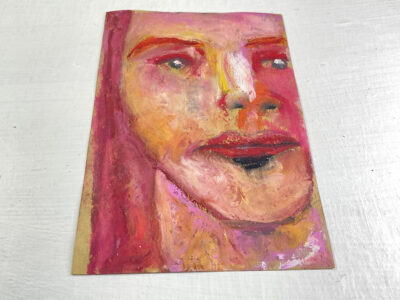 Oil pastel portrait painting of a woman with pink hair by Katie Jeanne Wood