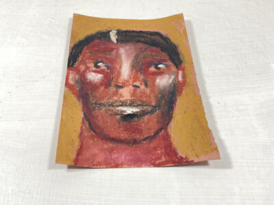 Oil pastel painting of a man on construction paper by Katie Jeanne Wood