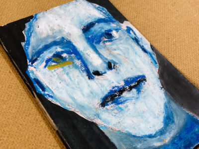 Oil pastel portrait painting of a blue bald man by artist Katie Jeanne Wood