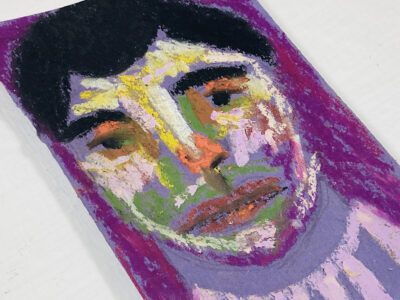 Oil pastel painting of a sad man on construction paper by Katie Jeanne Wood