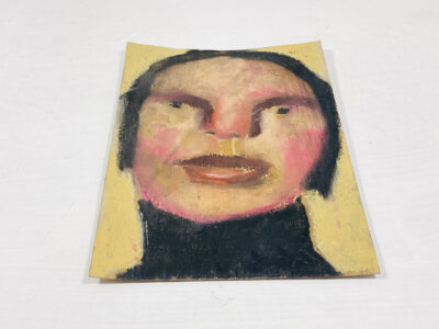 Oil pastel painting of a quiet woman on construction paper by Katie Jeanne Wood