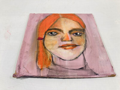 Oil pastel portrait painting of a woman with orange hair by Katie Jeanne Wood