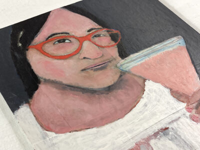 Acrylic portrait painting of a woman with a pink drink in hand by Katie Jeanne Wood