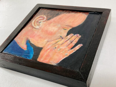 Acrylic portrait painting of a boy praying or meditating with a heavy handmade mahogany frame