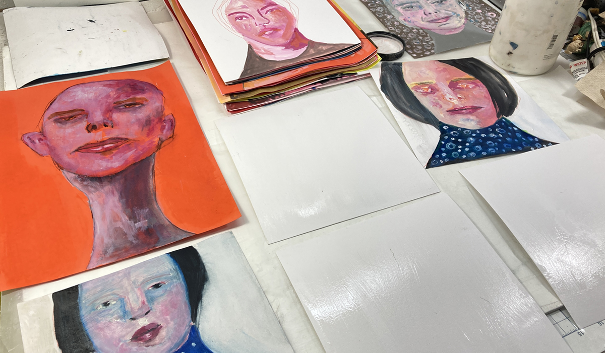 Glazing & stacking finished portrait paintings