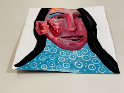 Gouache portrait painting of a woman titled More Resilient by Katie Jeanne Wood