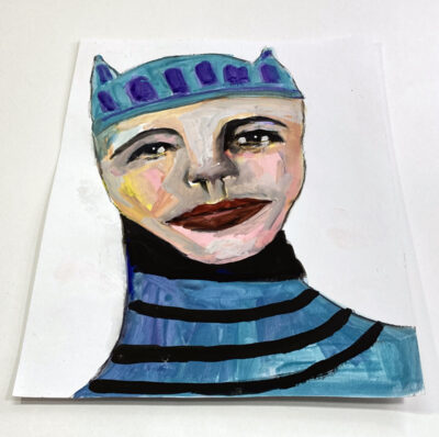 Gouache portrait painting of a boy wearing a blue hat with kitty ears titled Nuanced Personality by Katie Jeanne Wood