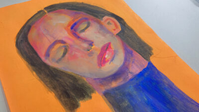 Gouache portrait painting of a woman titled Road to Tranquility on orange paper by Katie Jeanne Wood