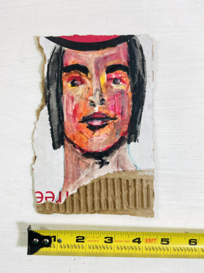 Oil pastel portrait painting of a woman on ripped cardboard