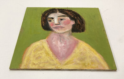 6x6 oil pastel portrait painting of a woman wearing yellow with a green background by Katie Jeanne Wood