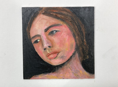 Revising an oil portrait painting of a woman outside on a starless night